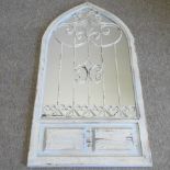 A blue painted arched wall mirror,
