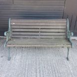 A green painted metal and slatted wooden garden bench,