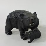 A black forest style model of a black bear with cub,