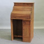An antique pine roll top single pedestal desk,