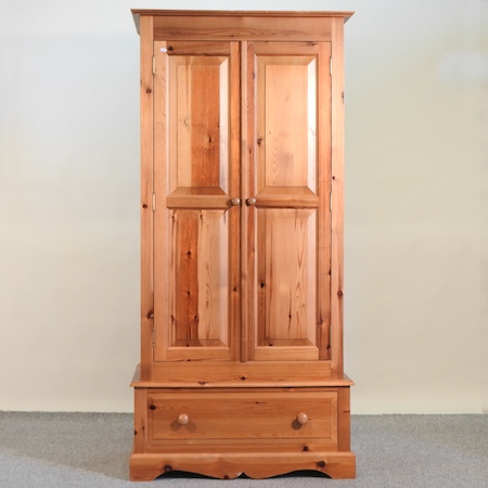 A modern pine double wardrobe,