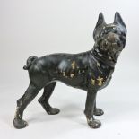 A painted metal model of a dog,