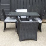 A rattan garden set, comprising a table 120 x 60cm and set of four chairs,