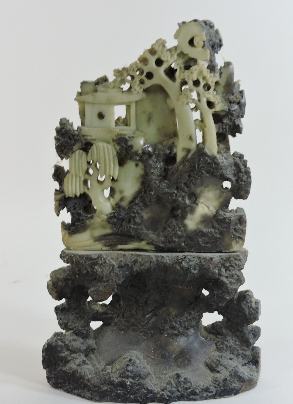 A Chinese soapstone carving of a rocky landscape, with buildings, trees and mountains, 22cm wide, - Image 9 of 13