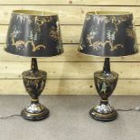 A pair of black painted table lamps and shades,