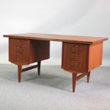 A 1970's Danish teak freestanding pedestal desk,