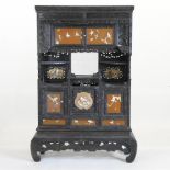 An early 20th century Japanese carved cabinet,