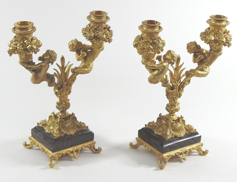 A pair of continental gilt bronze two branch table candelabra, decorated with fruit and putti, - Image 4 of 8