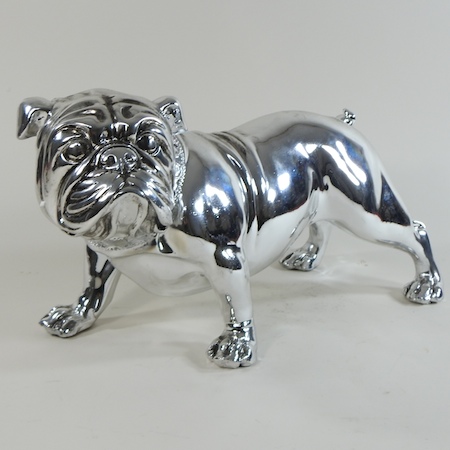 A silver painted model of a bull dog,