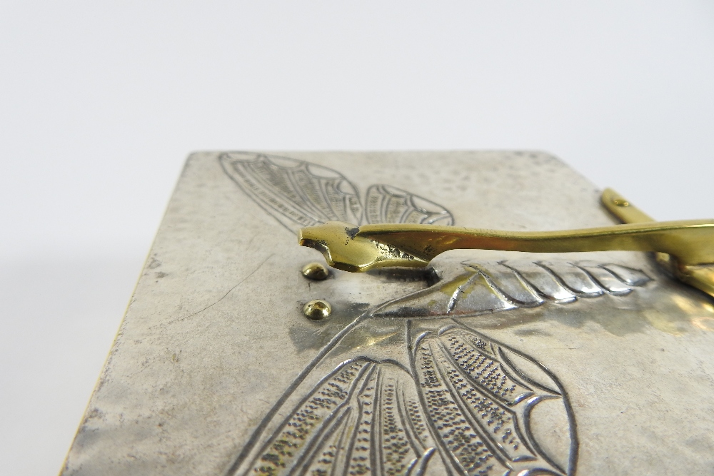 An early 20th century pewter box and cover, decorated in relief with a butterfly, - Image 5 of 6