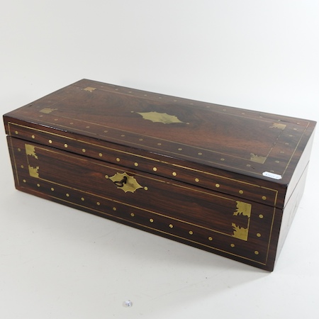 A Regency rosewood and cut brass inlaid writing slope, with a fitted interior,