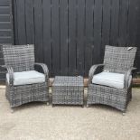 A garden set, comprising a pair of armchairs, with loose cushions and a square coffee table,