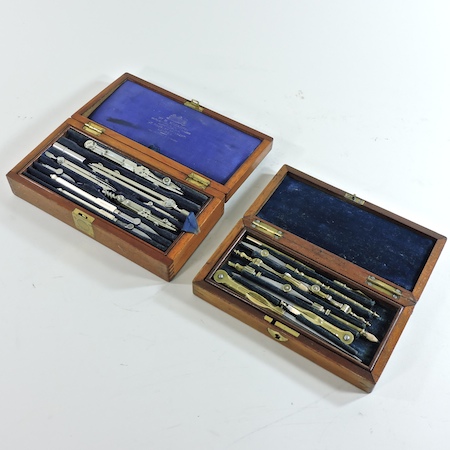 An early 20th century mahogany cased compass set,