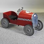 A vintage style red painted child's pedal car,