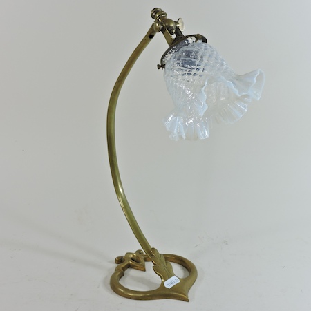 An Arts and Crafts brass desk lamp, of stylised form, in the manner of Benson, stamped AD 699,