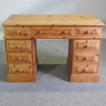 A modern pine pedestal desk,