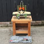 An Orteguil mitre cutter, on a stand, together with a ratchet winch,