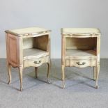 A pair of French style cream painted bedside cabinets, each with a single drawer below,
