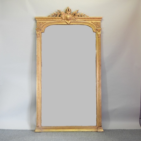 A large and ornate gilt framed wall mirror,