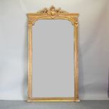 A large and ornate gilt framed wall mirror,