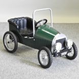 A vintage style green painted child's push-along car,