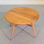An Ercol light elm side table, with a drop leaf,