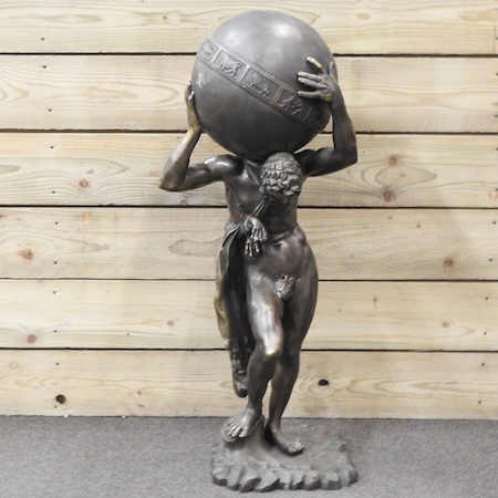 A large patinated bronze figure of Atlas,