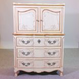 A French style cream painted cabinet on chest, with foliate decoration,