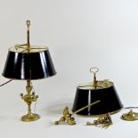 A pair of brass desk lamps, with black shades, one in sections,