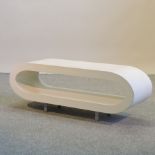 A 1960's white oval coffee table,