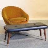 A 1960's gold upholstered swivel armchair,