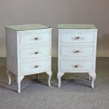 A pair of white painted bedside chests,