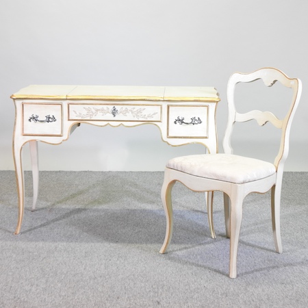 A French style cream painted dressing table, on cabriole legs, 104cm,