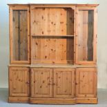 A Ducal pine breakfront bookcase,