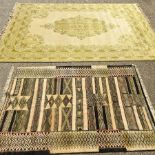 A woollen carpet, with a central medallion and foliate design, on a green ground, 370 x 270cm,