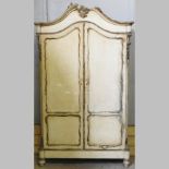 An early 20th century French cream painted armoire,