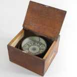 An early 20th century ship's compass, in a wooden case,