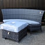 A curved rattan garden bench, with cushions, 175cm,
