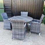 A black and grey circular rattan garden table, 121cm,