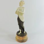 A bronze figure of a girl,