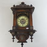 A 19th century fruitwood wall clock,