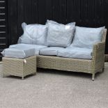 A beige rattan three seater garden sofa, with cushions, 170cm,