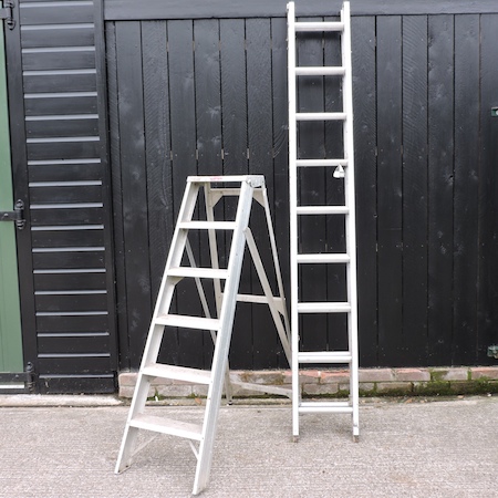 An aluminium extending ladder, in two sections, 460cm overall,