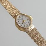 A mid 20th century 9 carat gold cased Rotary ladies wristwatch, on a flexible 9 carat gold strap,