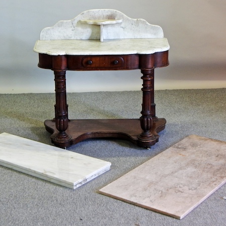 A Victorian mahogany washstand, with a marble top,