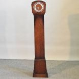 A 1930's oak granddaughter clock,