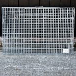 A metal folding dog cage,