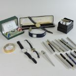 A collection of modern wristwatches, together with ballpoint pens,