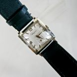 A vintage gentleman's wristwatch, the dial signed Ingraham, on a green leather strap,