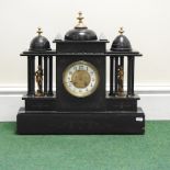 A large Victorian black slate mantel clock of architectural form,